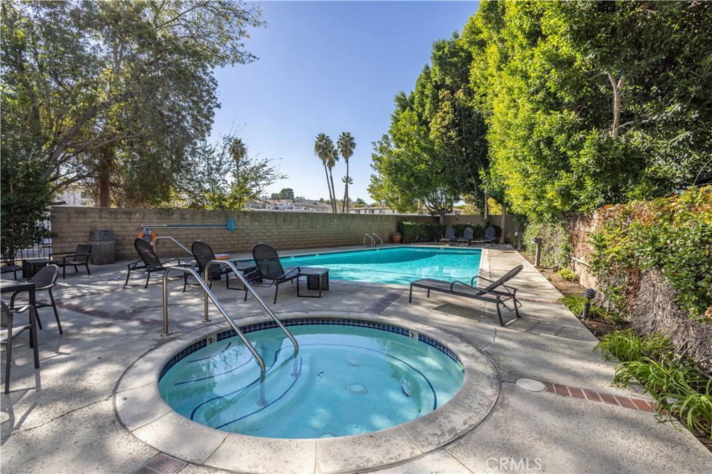 13331 Moorpark Street, Unit 319 Sherman Oaks, CA 91423 - Photo 26 of 46 a view of a swimming pool with sitting area