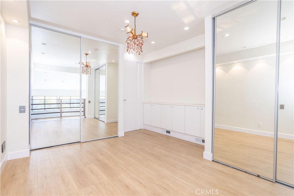 13331 Moorpark Street, Unit 319 Sherman Oaks, CA 91423 - Photo 3 of 46 wooden floor in an empty room with a window