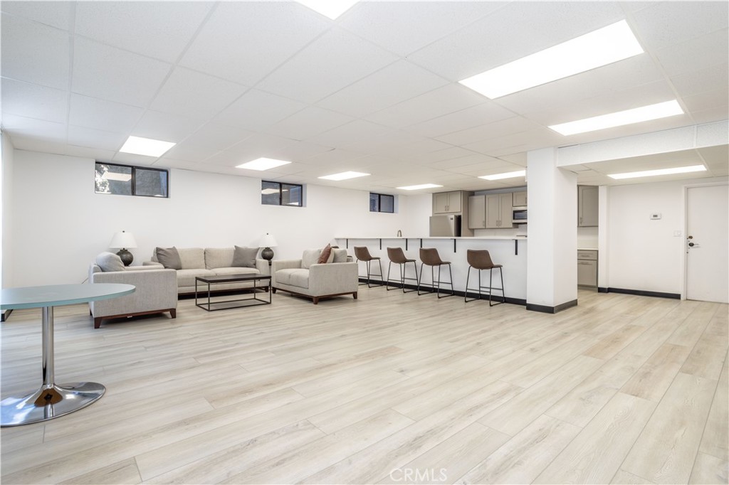 13331 Moorpark Street, Unit 319 Sherman Oaks, CA 91423 - Photo 33 of 46 a living room with furniture and a wooden floor