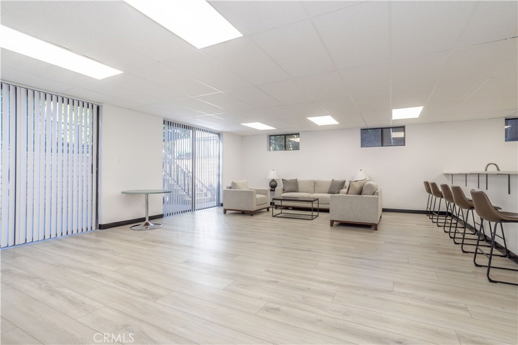 13331 Moorpark Street, Unit 319 Sherman Oaks, CA 91423 - Photo 39 of 46 a living room with furniture and a wooden floor
