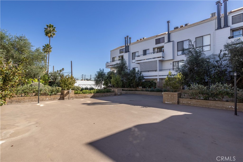 13331 Moorpark Street, Unit 319 Sherman Oaks, CA 91423 - Photo 44 of 46 a view of a street with a building in the background