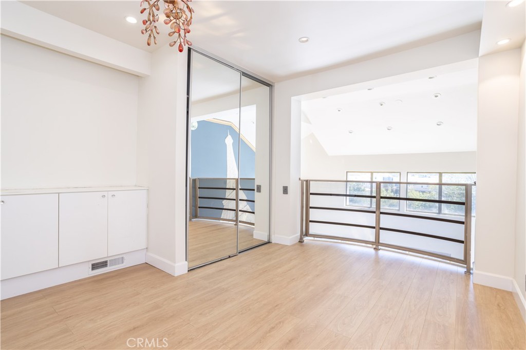 13331 Moorpark Street, Unit 319 Sherman Oaks, CA 91423 - Photo 7 of 46 wooden floor in an empty room