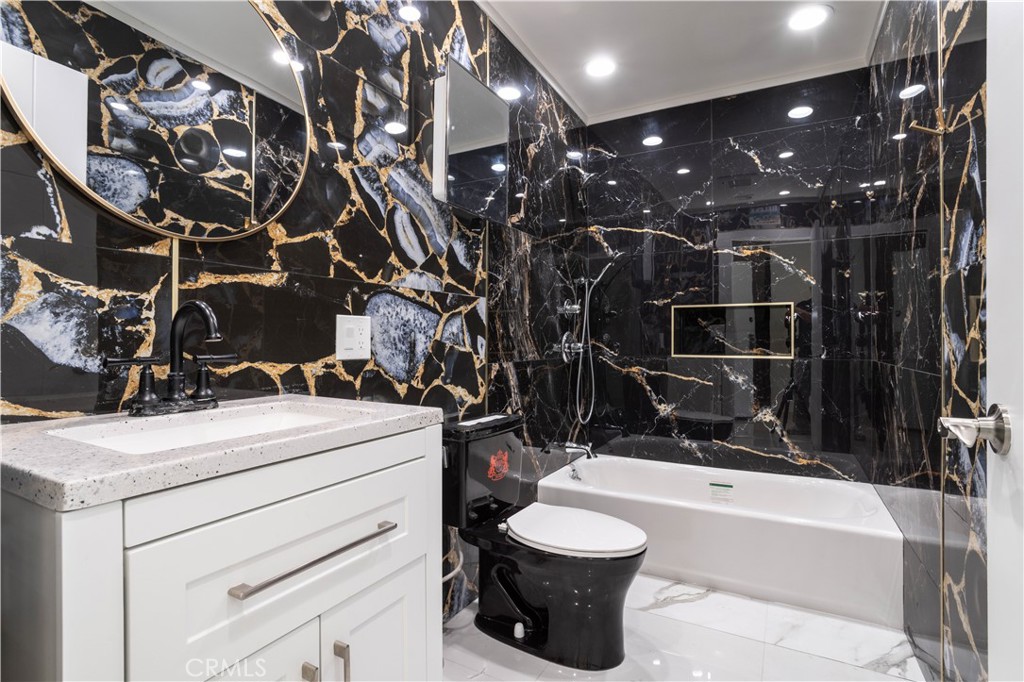 13331 Moorpark Street, Unit 319 Sherman Oaks, CA 91423 - Photo 8 of 46 a bathroom with a sink a toilet and shower