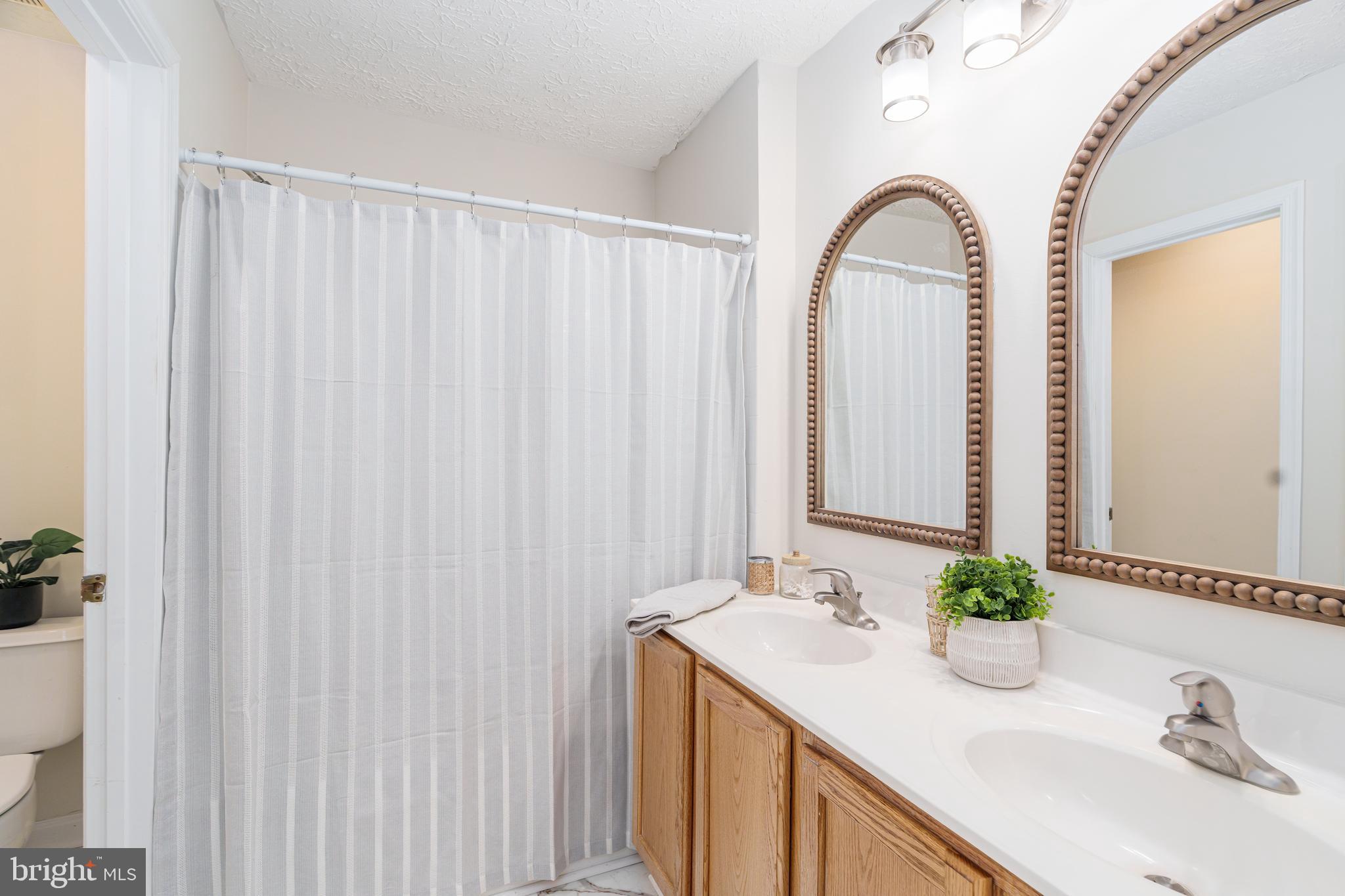 434 Buttonwoods Road Elkton, MD 21921 - Photo 12 of 16 Full bathroom with tub shower and dual vanity