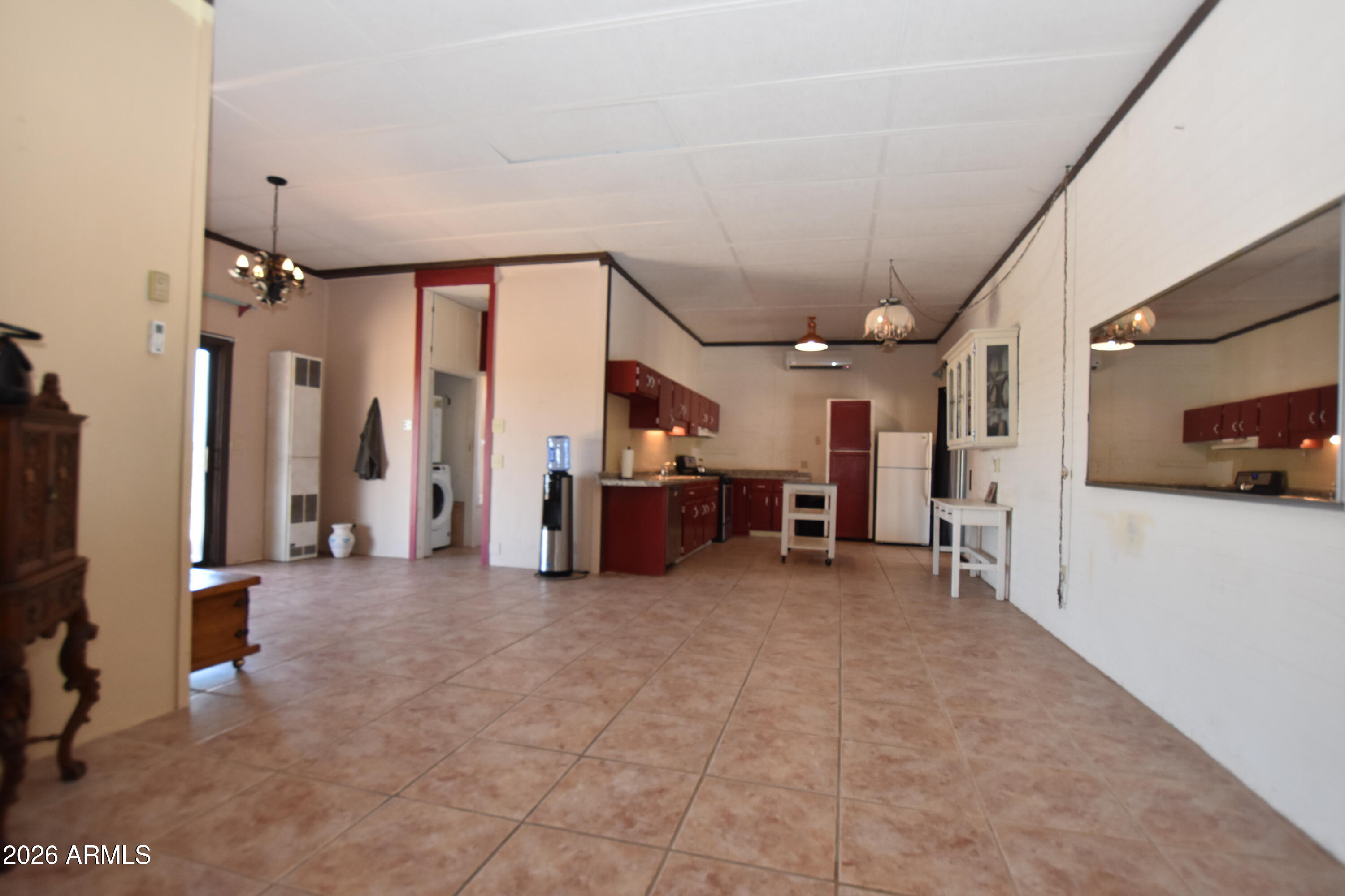 1140 West Briggs Road Ajo, AZ 85321 - Photo 12 of 42 a view of a hallway with seating area
