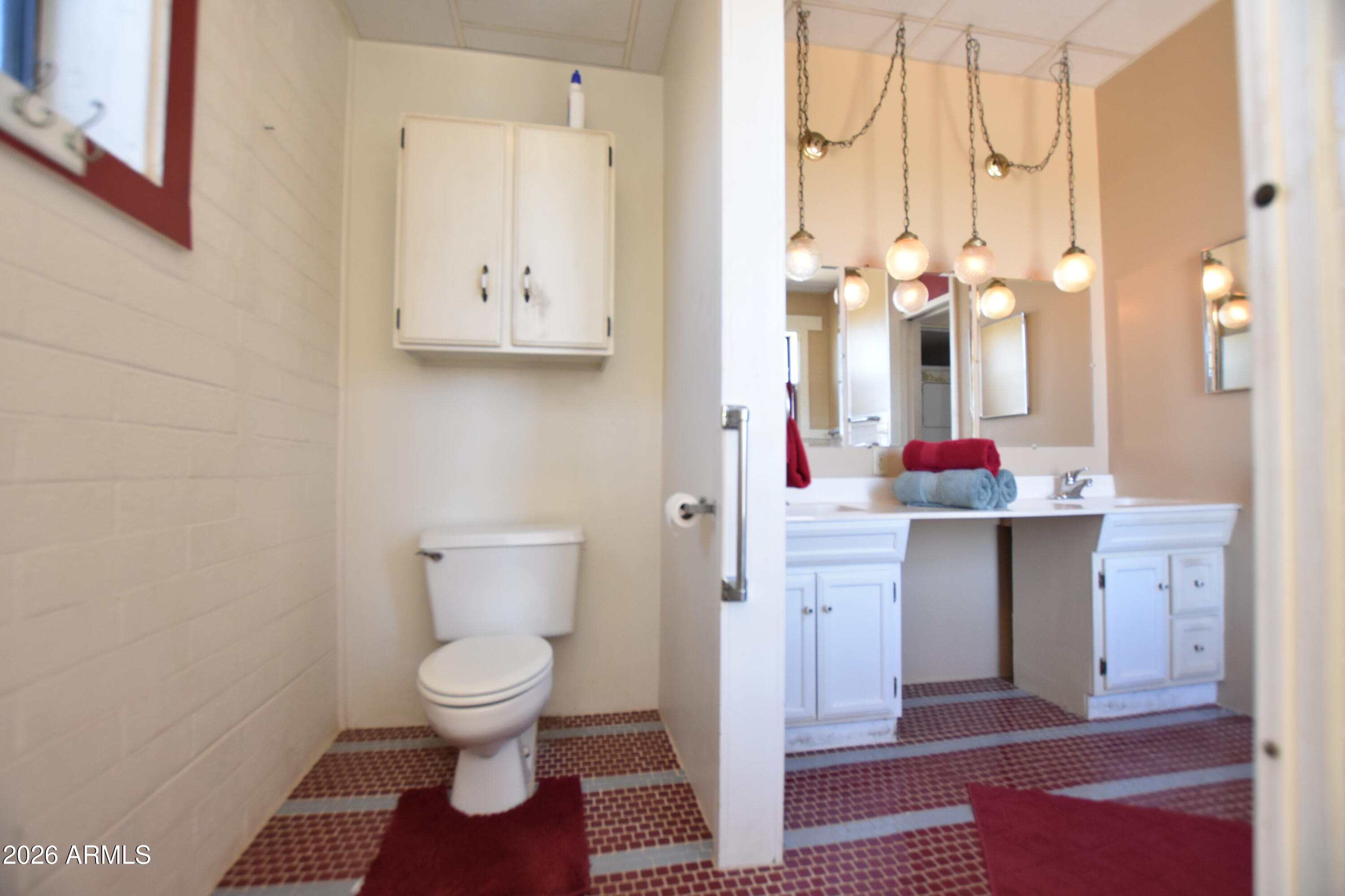 1140 West Briggs Road Ajo, AZ 85321 - Photo 14 of 42 a bathroom with a sink and a mirror