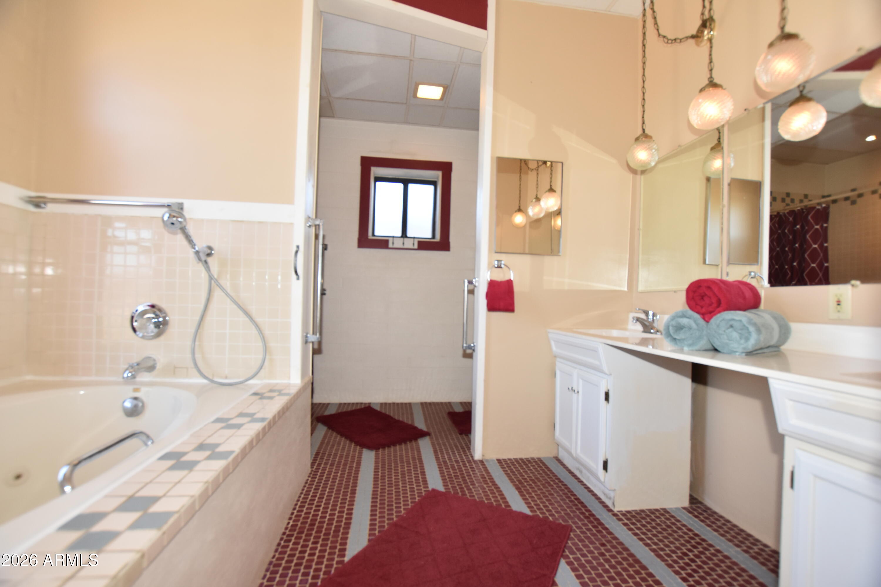 1140 West Briggs Road Ajo, AZ 85321 - Photo 15 of 42 a bathroom with a granite countertop sink and a mirror