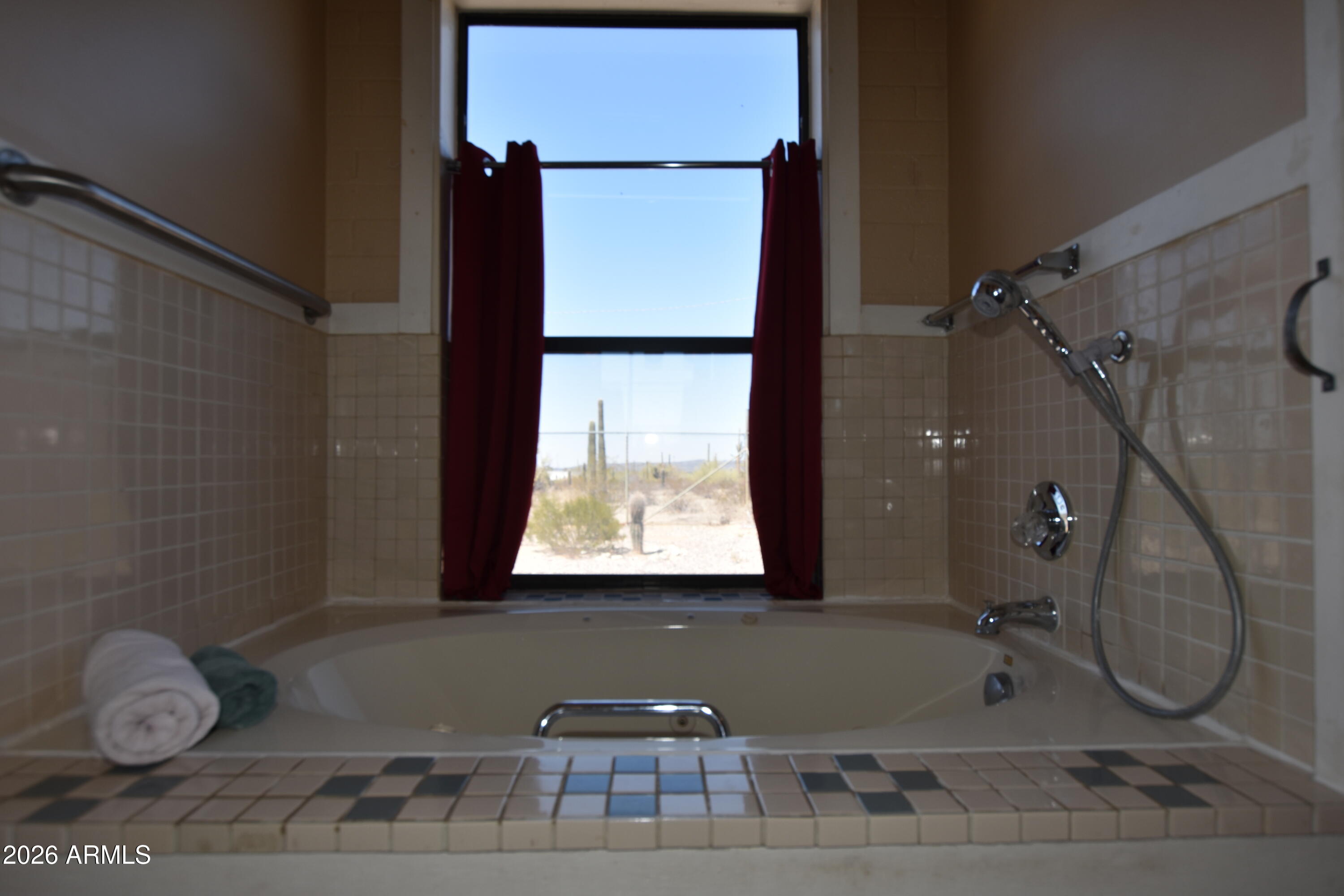 1140 West Briggs Road Ajo, AZ 85321 - Photo 18 of 42 a bathroom with a granite countertop sink and a mirror