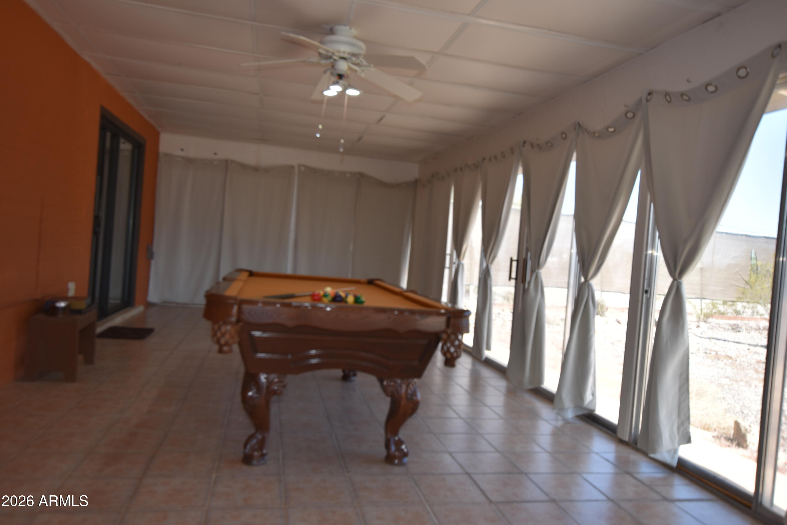 1140 West Briggs Road Ajo, AZ 85321 - Photo 24 of 42 a room with furniture and a chandelier