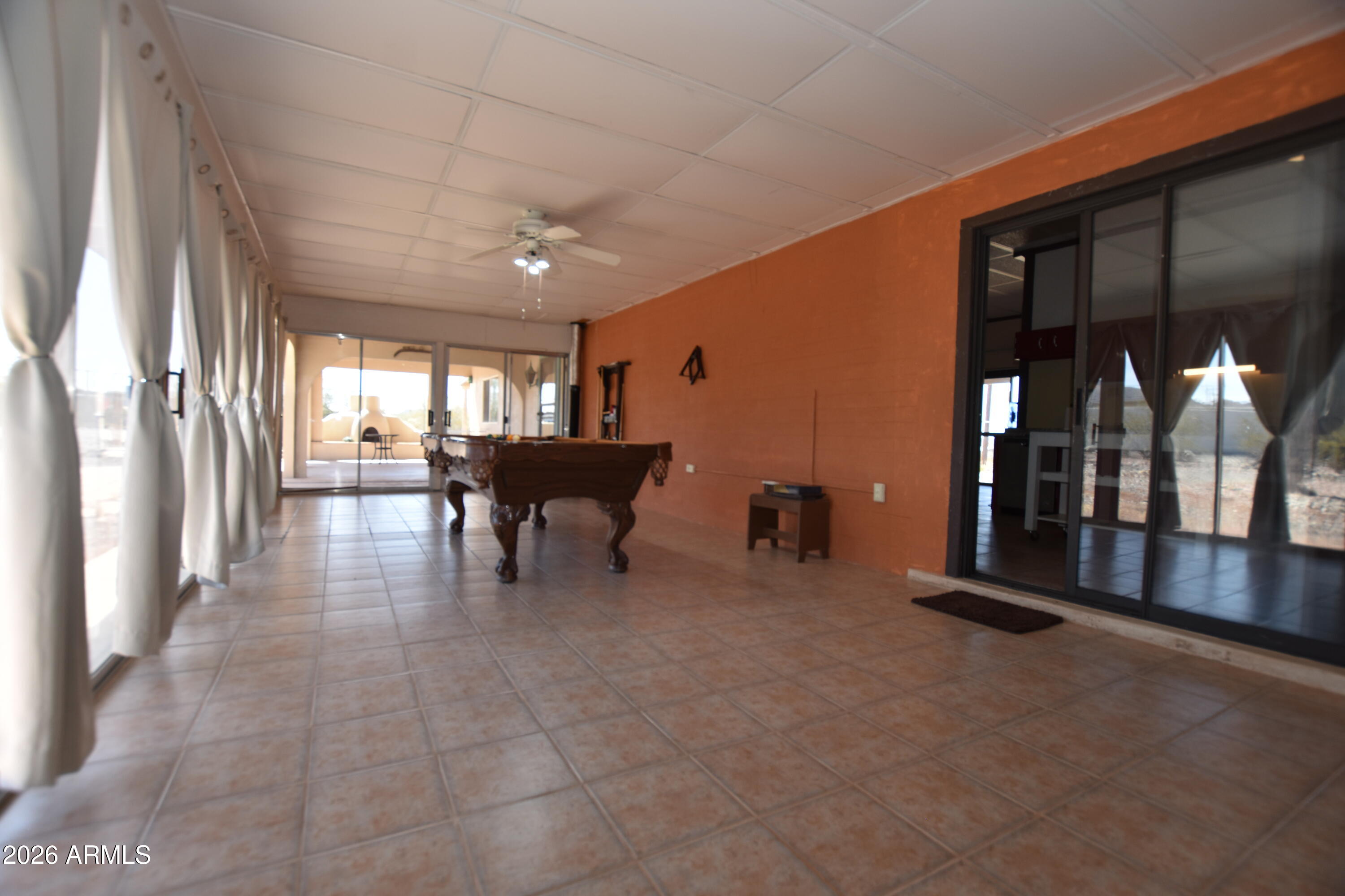 1140 West Briggs Road Ajo, AZ 85321 - Photo 26 of 42 a lobby with furniture and floor to ceiling window