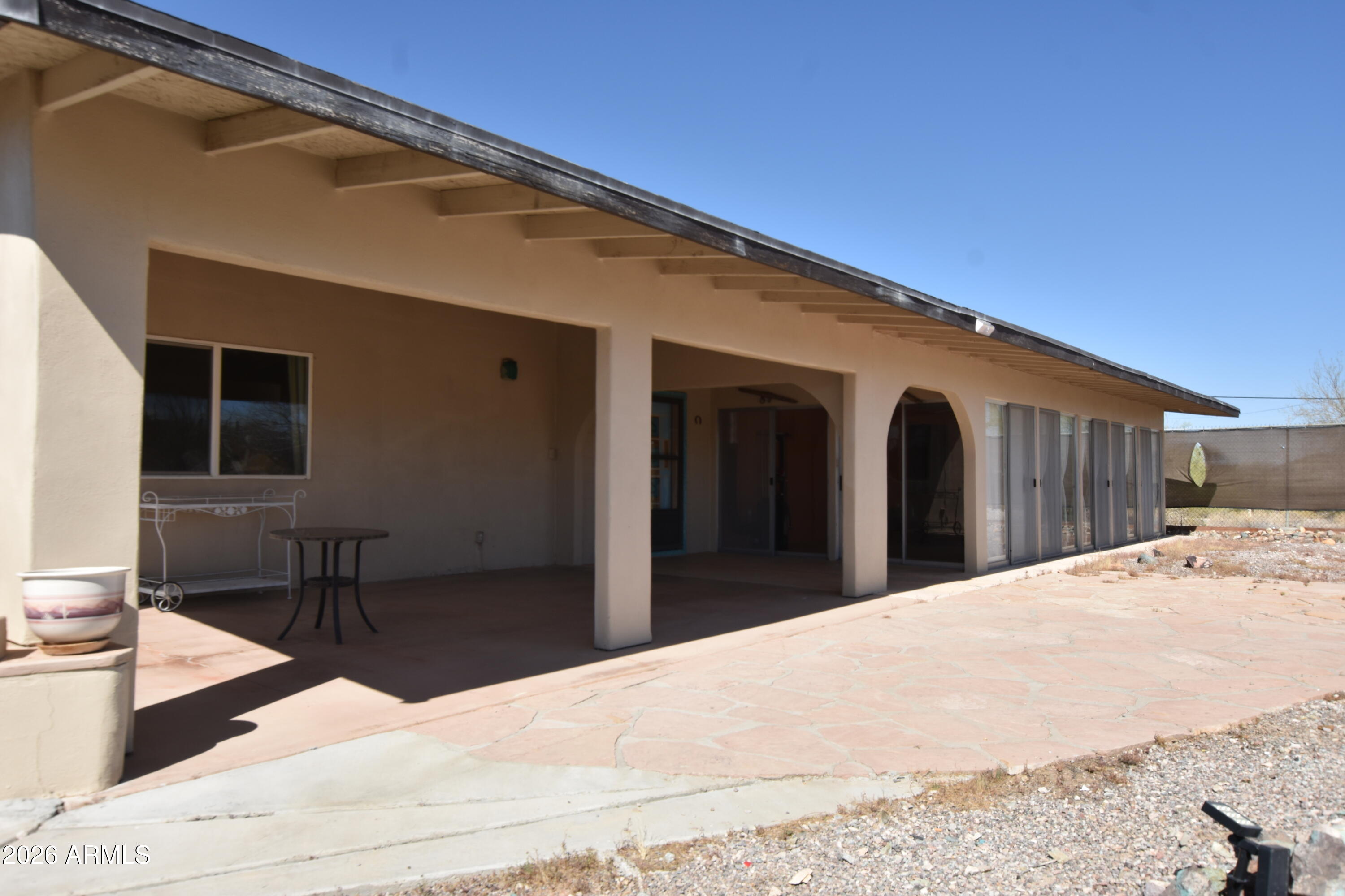 1140 West Briggs Road Ajo, AZ 85321 - Photo 32 of 42 a view of a house with a backyard
