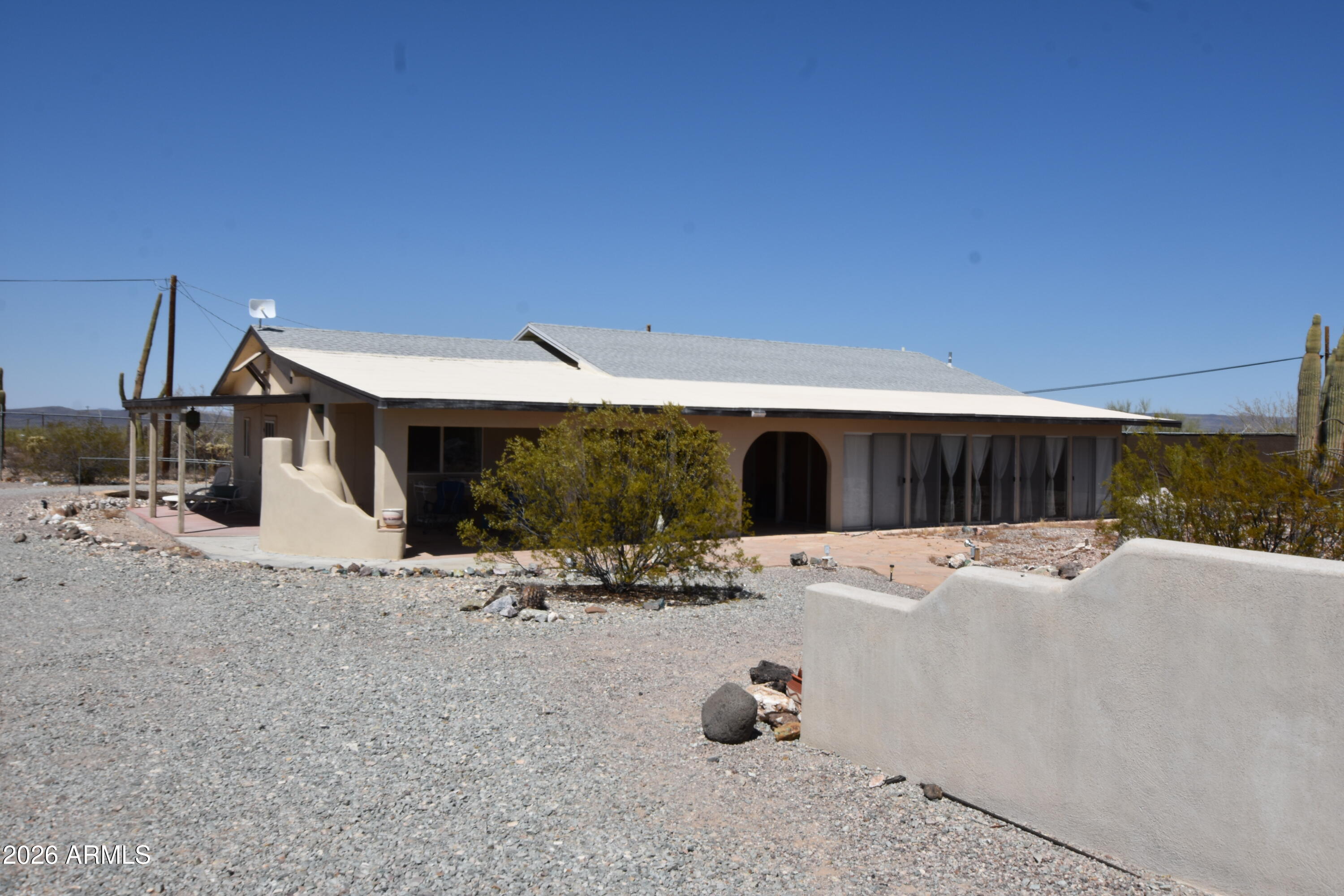1140 West Briggs Road Ajo, AZ 85321 - Photo 37 of 42 a car parked in front of a house