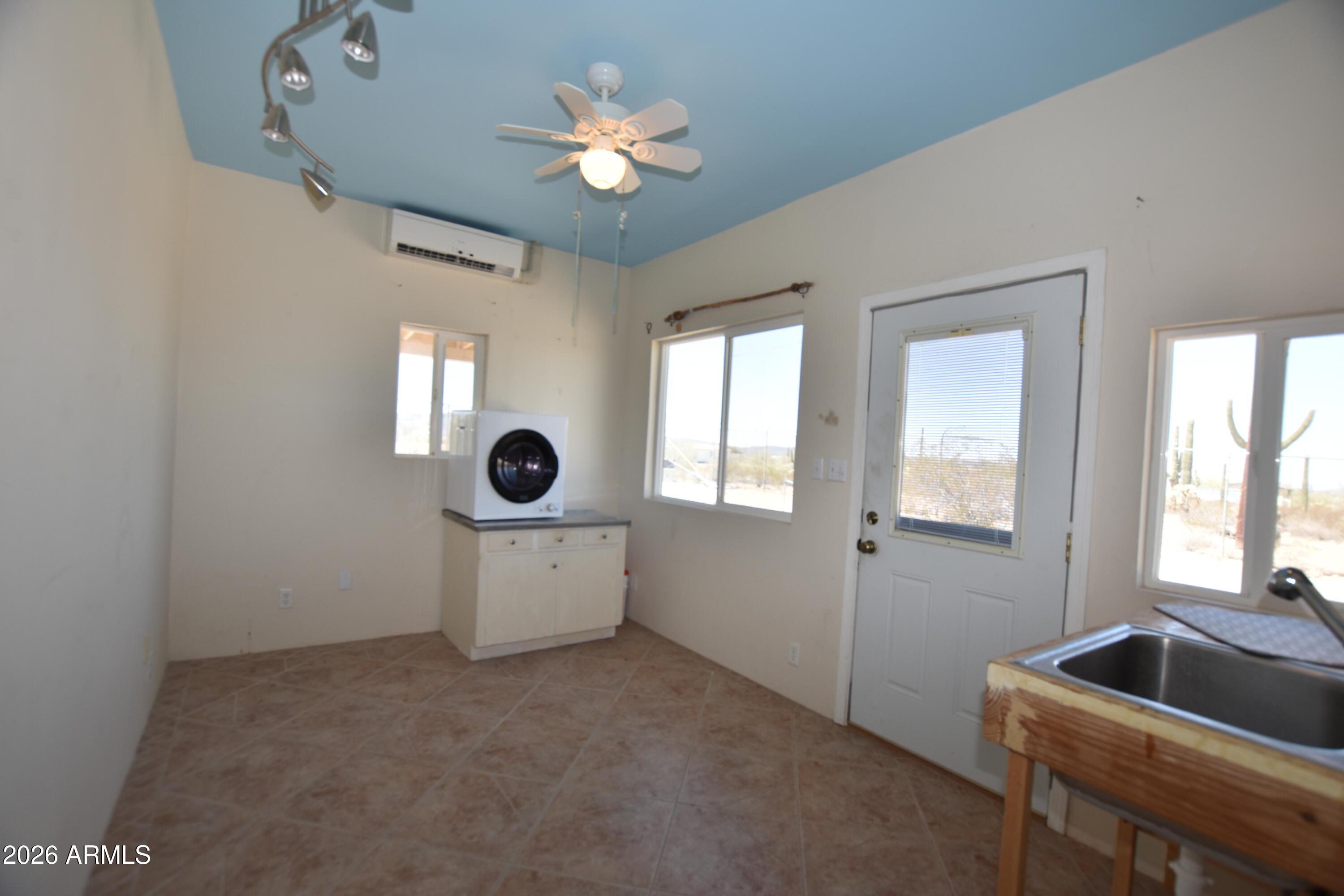 1140 West Briggs Road Ajo, AZ 85321 - Photo 42 of 42 a living room with furniture and a window