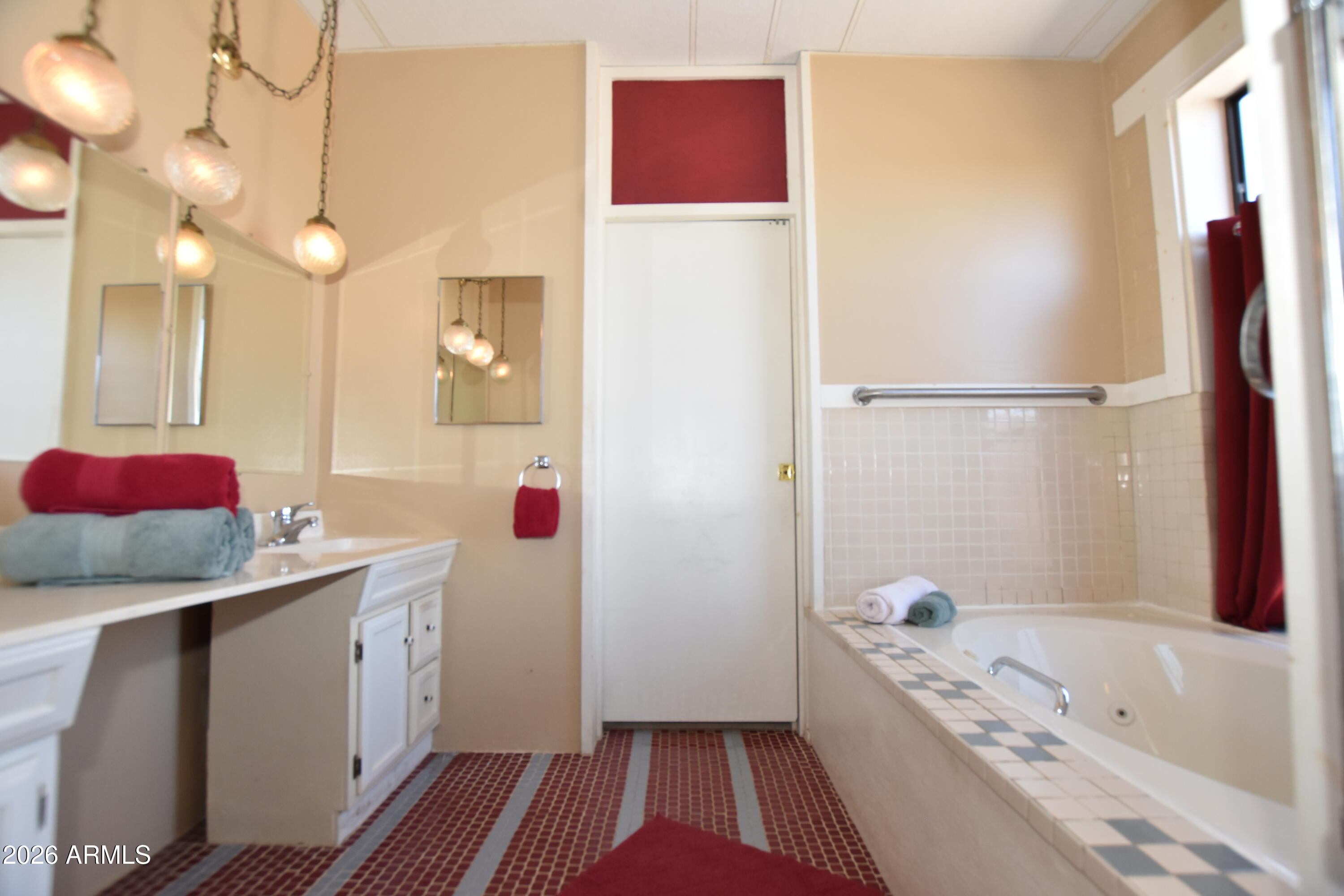 1140 West Briggs Road Ajo, AZ 85321 - Photo 5 of 42 a bathroom with a bathtub sink and mirror