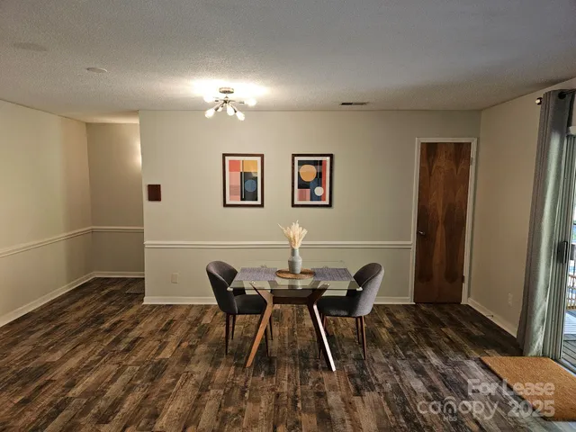 a workspace room with furniture and wooden floor