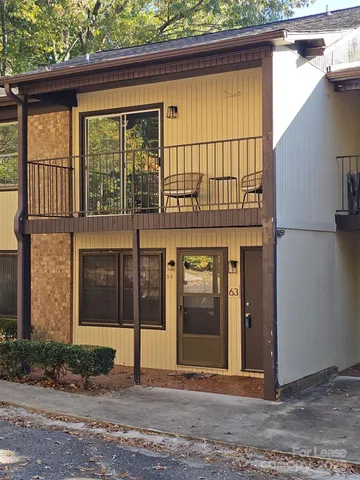 a view of a brick house with a large windows