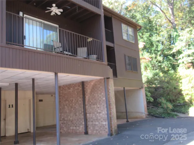 a view of a house with a small yard