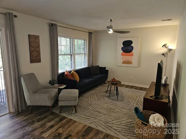 a living room with furniture and a window