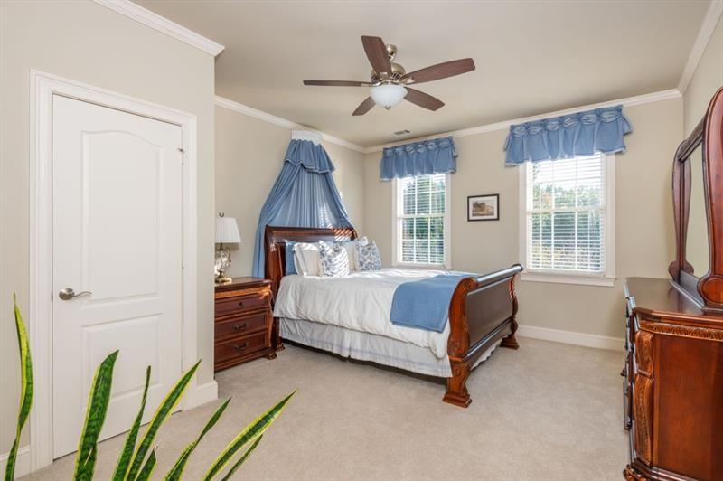 220 Edwards Brook Court Canton, GA 30115 - Photo 49 of 77 a bed room with a bed and a window
