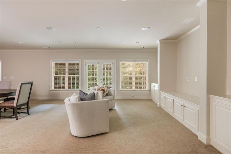 220 Edwards Brook Court Canton, GA 30115 - Photo 57 of 77 a living room with furniture and a window