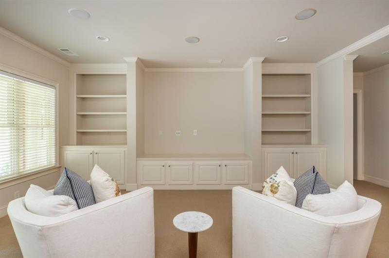 220 Edwards Brook Court Canton, GA 30115 - Photo 59 of 77 a living room with furniture and a window