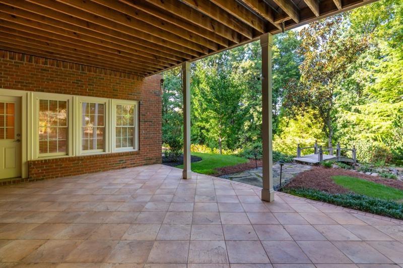 220 Edwards Brook Court Canton, GA 30115 - Photo 62 of 77 a view of a house with a backyard