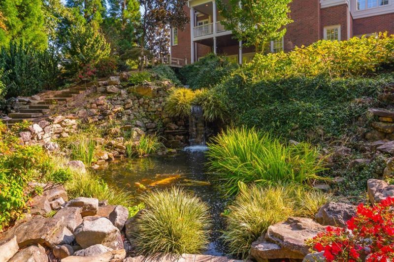 220 Edwards Brook Court Canton, GA 30115 - Photo 68 of 77 a view of a garden with a house