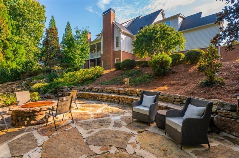 220 Edwards Brook Court Canton, GA 30115 - Photo 70 of 77 a view of a chairs and table in the patio