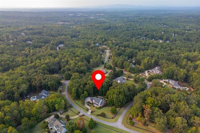 220 Edwards Brook Court Canton, GA 30115 - Photo 71 of 77 an aerial view of a house with a backyard