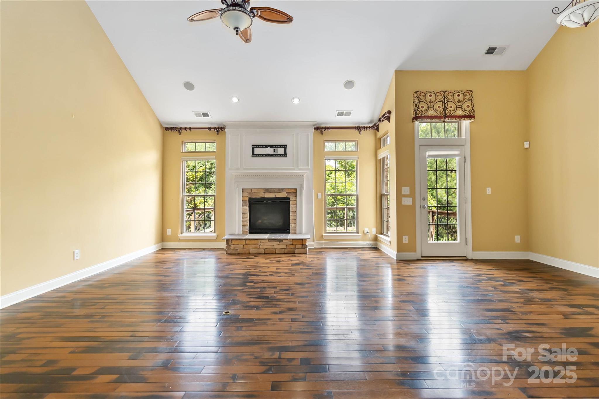 2346 Donnington Lane Northwest Concord, NC 28027 - Photo 3 of 5 a view of an empty room with window and wooden floor