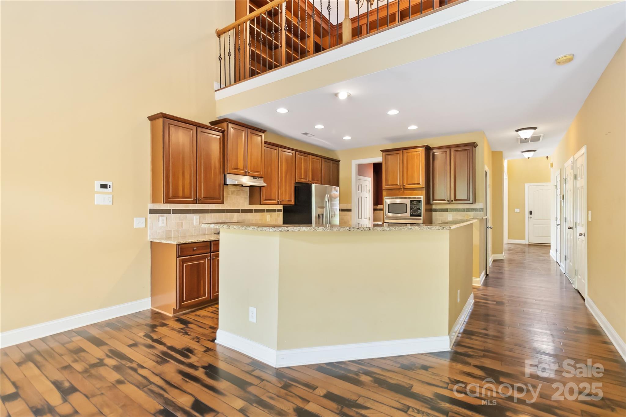 2346 Donnington Lane Northwest Concord, NC 28027 - Photo 4 of 5 a view of kitchen with stainless steel appliances granite countertop a refrigerator and a stove top oven