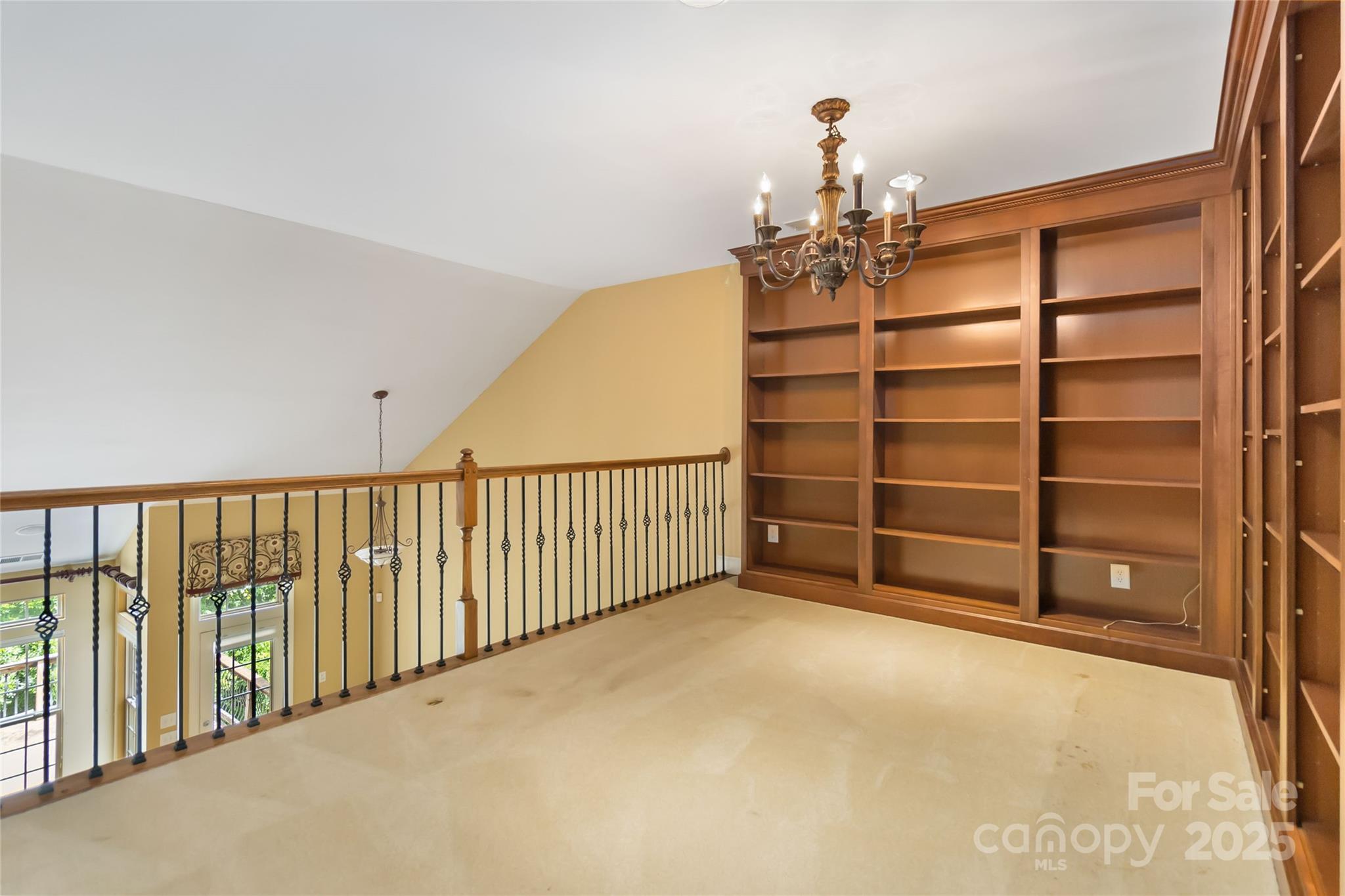 2346 Donnington Lane Northwest Concord, NC 28027 - Photo 5 of 5 a view of a big room with chandelier closet and windows