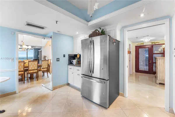 a kitchen with stainless steel appliances granite countertop a refrigerator and a refrigerator