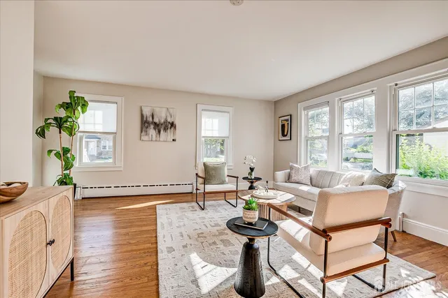 a view of a dining room with furniture window and wooden floor