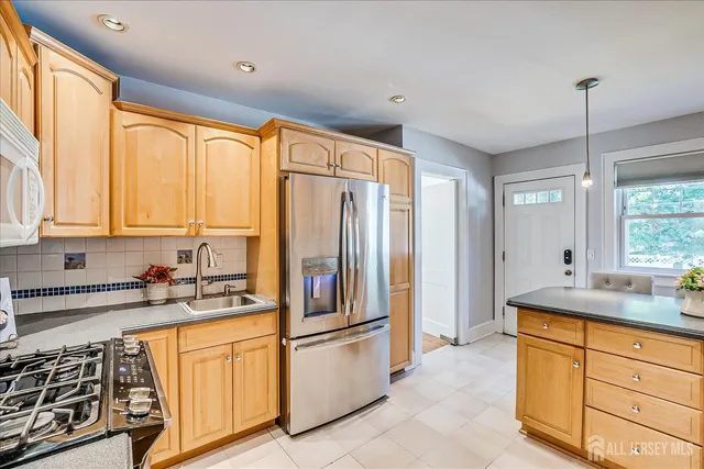 a kitchen with sink cabinets and window