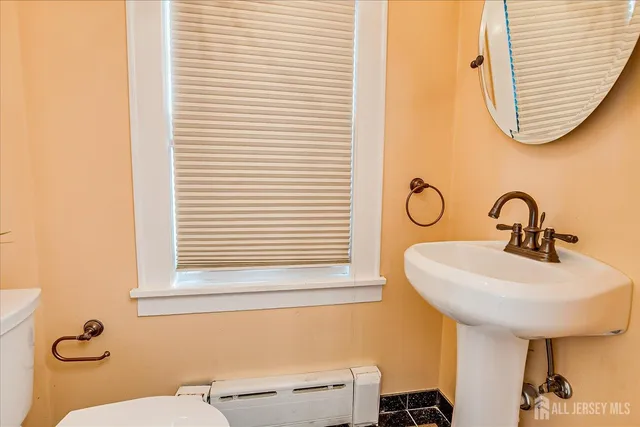 a view of an entryway with wooden floor and stairs