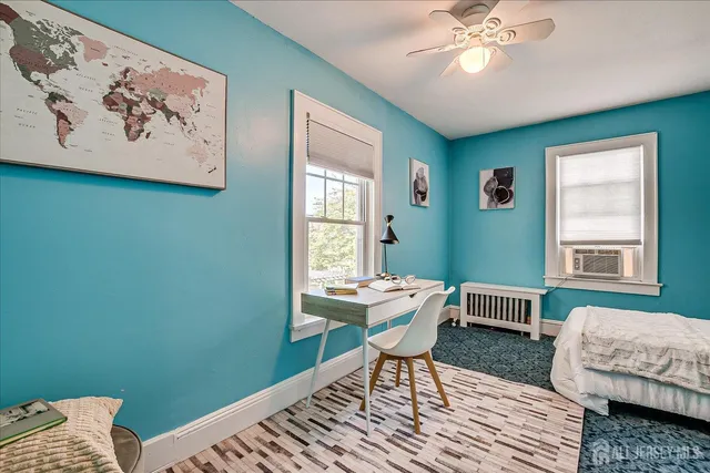 a bedroom with bed and a window