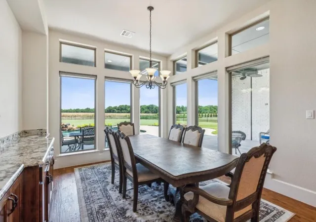 a view of a dining room with furniture window and outside view
