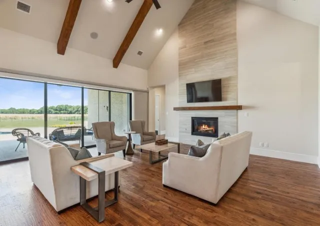 a living room with fireplace furniture and a flat screen tv