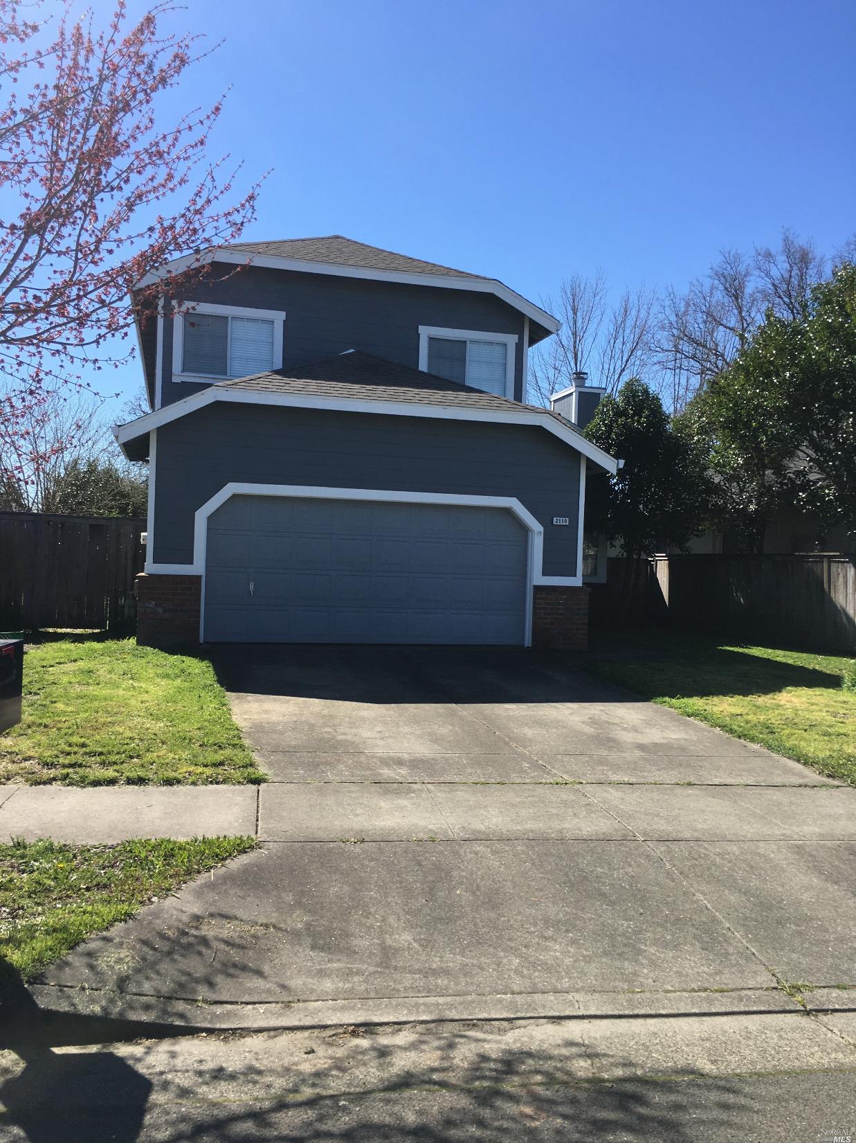 2110 Crosspoint Avenue Santa Rosa, CA 95403 - Photo 1 of 1 a front view of a house with a yard and garage