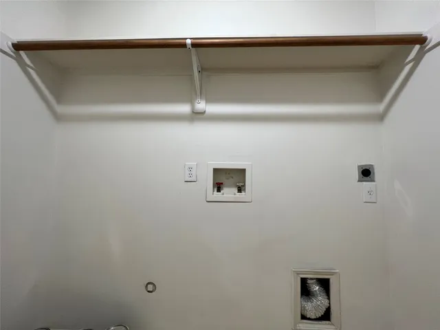 a view of room that has a bed and a window