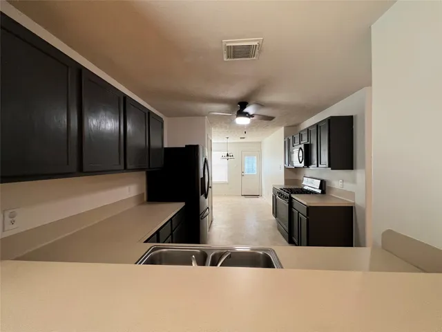 a lobby with furniture and a flat screen tv