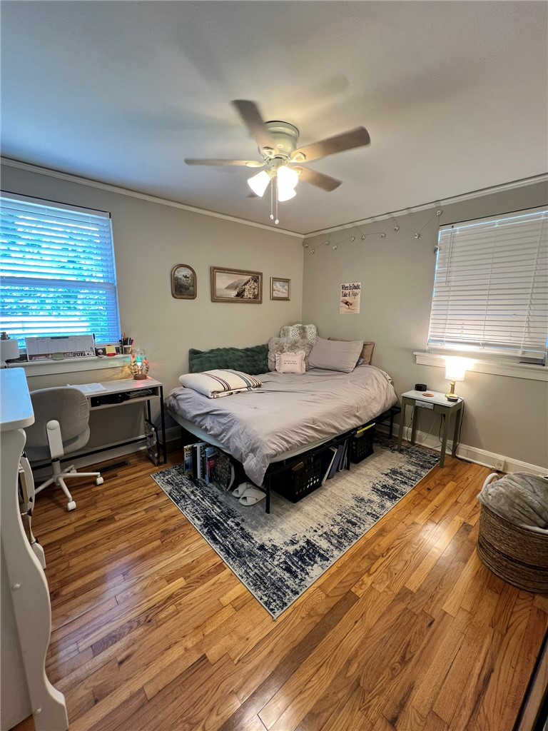 101 Clinton Drive, Unit B Anderson, SC 29621 - Photo 5 of 18 This cozy bedroom features durable hardwood floors and ample natural light, perfect for relaxation.