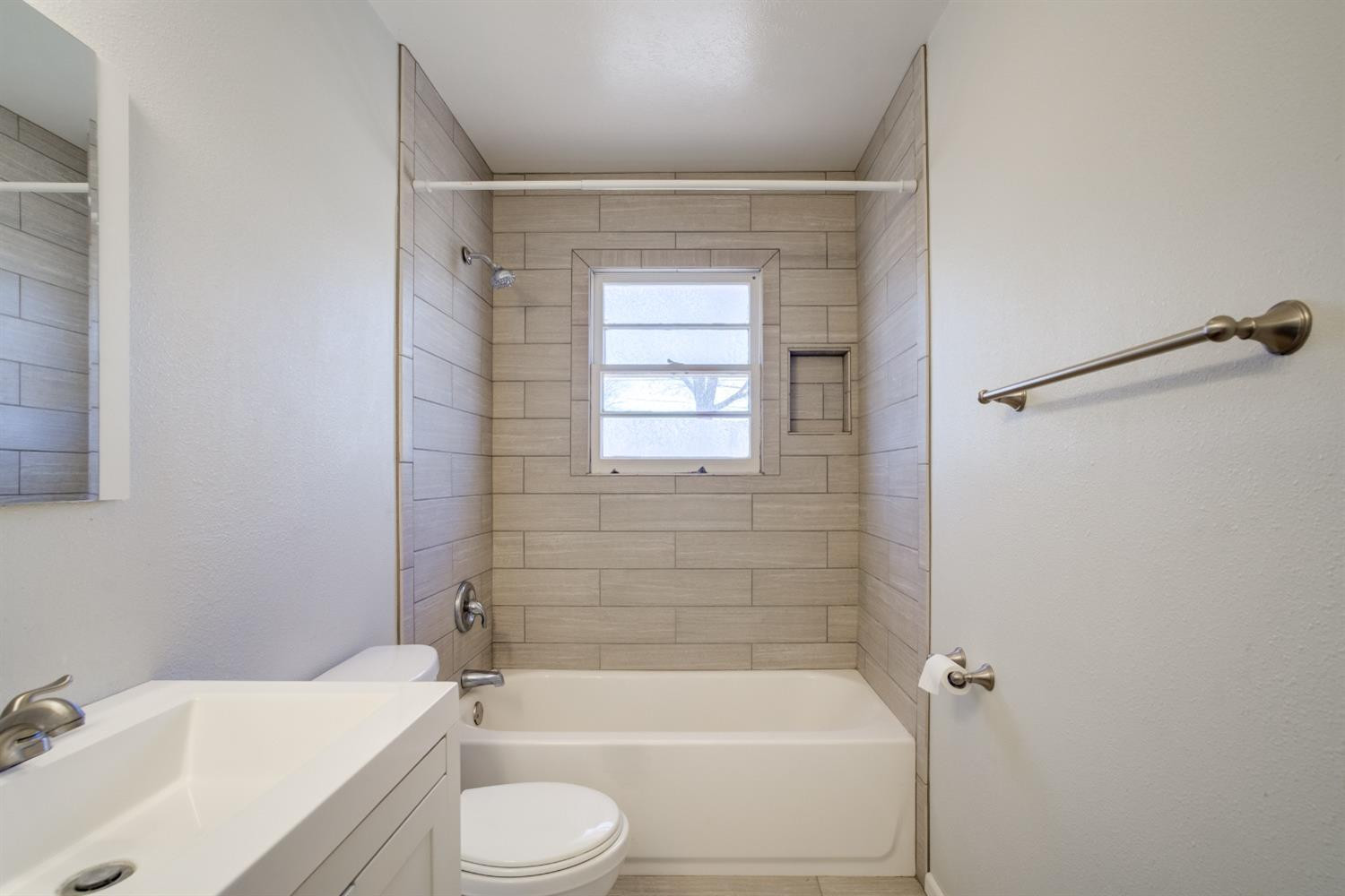 3011 44th Street Lubbock, TX 79413 - Photo 12 of 19 a bathroom with a toilet and shower