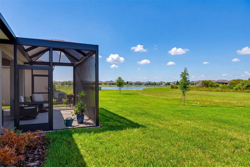 18237 Beach Ranch Terrace Bradenton, FL 34211 - Photo 53 of 72 a view of a big room with a big yard