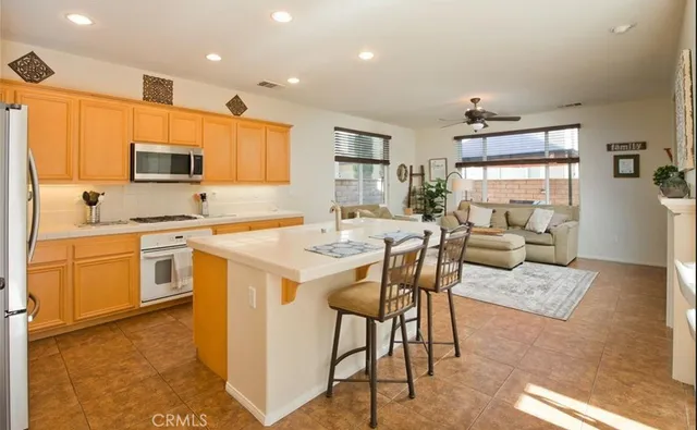 a kitchen with a sink cabinets and wooden floor