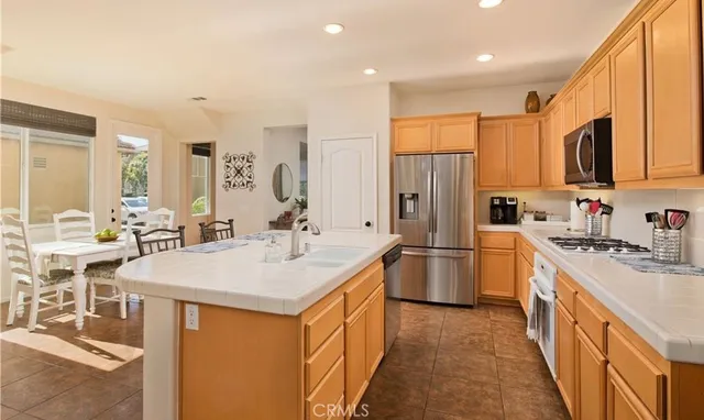 a kitchen with a sink stove and refrigerator