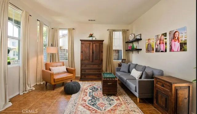 a living room with furniture and a rug