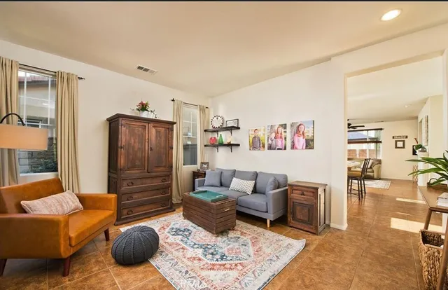 a living room with furniture or couch and a dining table