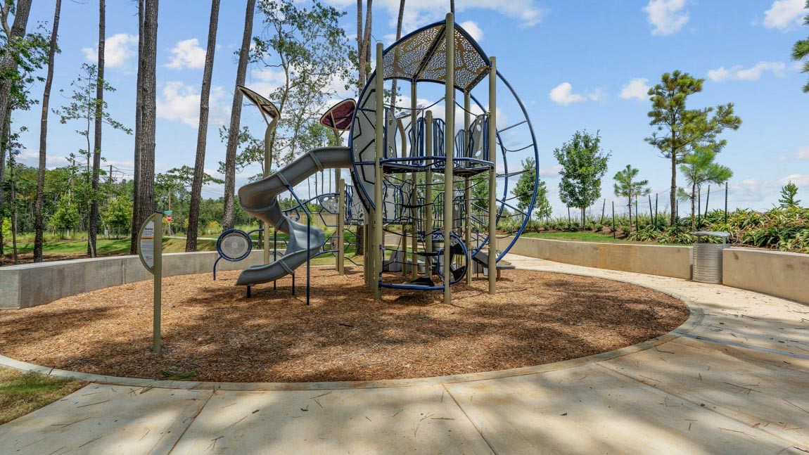 4436 Wapama Falls Loop Conroe, TX 77303 - Photo 28 of 39 a view of a park with swings and slides